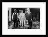 Family standing in front of garage, ca. 1925 by Anonymous