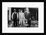 Family standing in front of garage, ca. 1925 by Anonymous