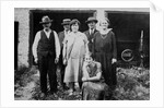 Family standing in front of garage, ca. 1925 by Anonymous