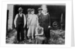 Family standing in front of garage, ca. 1925 by Anonymous