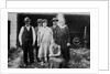 Family standing in front of garage, ca. 1925 by Anonymous