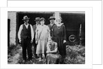 Family standing in front of garage, ca. 1925 by Anonymous