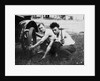 Young men change a tire on an automobile, ca. 1918 by Anonymous