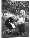 Mother to be with stroller at baby shower, ca. 1924 by Anonymous