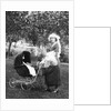 Mother to be with stroller at baby shower, ca. 1924 by Anonymous