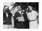 Boy with his parents on his 8th grade graduation, ca. 1940 by Anonymous