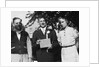 Boy with his parents on his 8th grade graduation, ca. 1940 by Anonymous