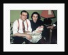 Young couple holding baby boy in christening gown, ca. 1952 by Anonymous