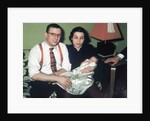 Young couple holding baby boy in christening gown, ca. 1952 by Anonymous