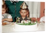 Grumpy boy at fifth birthday party, ca. 1957 by Anonymous