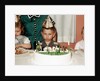 Grumpy boy at fifth birthday party, ca. 1957 by Anonymous