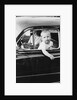 Young boy hangs out of driver's side car window, ca. 1954 by Anonymous