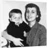 Mother holding son playing peek-a-boo, ca. 1955 by Anonymous