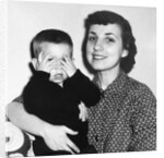 Mother holding son playing peek-a-boo, ca. 1955 by Anonymous