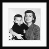 Mother holding son playing peek-a-boo, ca. 1955 by Anonymous