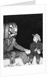 Young boy warily eyes pumpkin man, ca. 1955 by Corbis