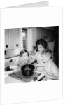 Mom prepares dinner with the kids watching, ca. 1962 by Anonymous