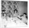 Mother with children at the dinner table, ca. 1962 by Anonymous
