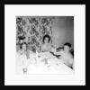 Mother with children at the dinner table, ca. 1962 by Anonymous