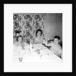 Mother with children at the dinner table, ca. 1962 by Anonymous