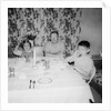 Father with children at the dinner table, ca. 1962 by Anonymous