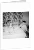 Father with children at the dinner table, ca. 1962 by Anonymous