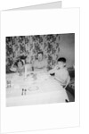Father with children at the dinner table, ca. 1962 by Anonymous