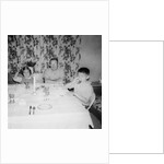 Father with children at the dinner table, ca. 1962 by Anonymous