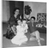 Mother with son and daughter in living room, ca. 1960 by Anonymous