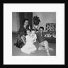 Mother with son and daughter in living room, ca. 1960 by Anonymous