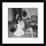 Mother with son and daughter in living room, ca. 1960 by Anonymous