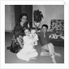 Mother with son and daughter in living room, ca. 1960 by Anonymous
