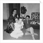 Mother with son and daughter in living room, ca. 1960 by Anonymous