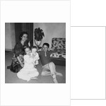 Mother with son and daughter in living room, ca. 1960 by Anonymous