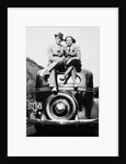 Couple proudly sits on their new car, ca. 1935 by Anonymous