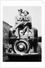 Couple proudly sits on their new car, ca. 1935 by Anonymous