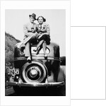 Couple proudly sits on their new car, ca. 1935 by Anonymous