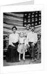 Family pose in front of American Flag, ca. 1898 by Anonymous