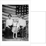 Family pose in front of American Flag, ca. 1898 by Anonymous