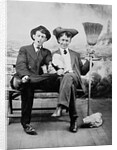 Two young men on a bench with a broom, ca. 1900 by Anonymous