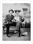 Two young men on a bench with a broom, ca. 1900 by Anonymous