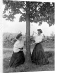 Two women chase each other around a tree, ca. 1910 by Anonymous
