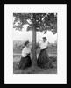 Two women chase each other around a tree, ca. 1910 by Anonymous