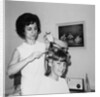Mother helps 16 year old daughter get ready for date, ca. 1970 by Anonymous