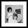 Mother helps 16 year old daughter get ready for date, ca. 1970 by Anonymous