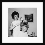 Mother helps 16 year old daughter get ready for date, ca. 1970 by Anonymous