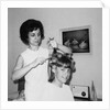 Mother helps 16 year old daughter get ready for date, ca. 1970 by Anonymous