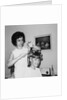 Mother helps 16 year old daughter get ready for date, ca. 1970 by Anonymous