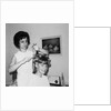 Mother helps 16 year old daughter get ready for date, ca. 1970 by Anonymous