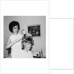Mother helps 16 year old daughter get ready for date, ca. 1970 by Anonymous